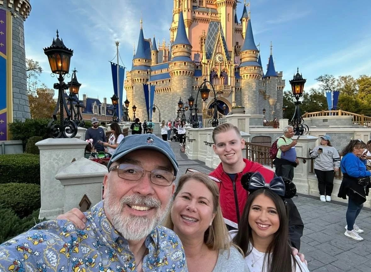Allison and Daniel with family at Magic Kingdom